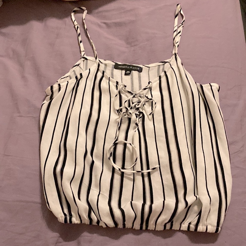 Kendall & Kylie; silky halter top is white w black stripes. Size XS
